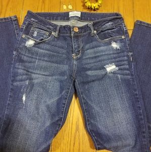 Distressed blue jeans